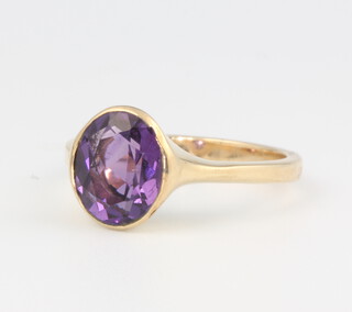 A 9ct yellow gold amethyst ring size O 1/2, 4.1 grams 