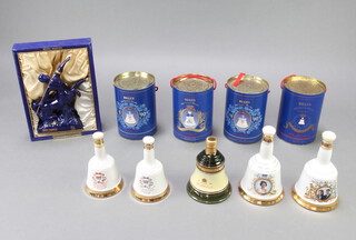 Remy Martin, a 1980's Limoges decanter in the form of a centaure containing brandy (the cork is loose and there has been some leakage so decanter must be kept upright) boxed, together with 9 Wade Bells Whisky commemorative decanters to celebrate different events (some with evaporation) 