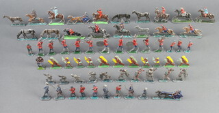 A collection of cast lead figures of horses and carts, mounted bandsmen
