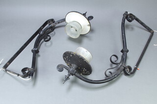 A pair of wrought iron external wall light brackets with glass shades 101cm h x 32cm w 