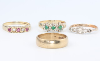 Three 9ct yellow gold gem set rings, size N, 5.8 grams and a 9ct yellow gold wedding band size O 3.8 grams