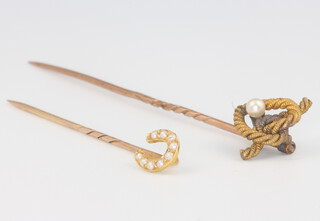 An Edwardian yellow gold pearl set horseshoe tie pin and a rope twist ditto 