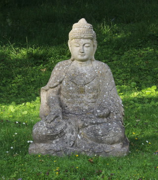 A well weathered reconstituted stone figure of a seated Buddha 66cm h x 53cm w x 40cm d 
