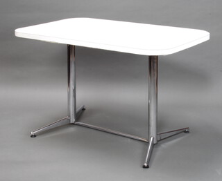 A polished tubular metal and white formica kitchen table 77cm h x 121cm l x 75.5cm w