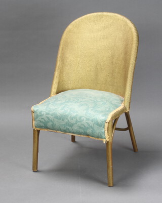 A gold painted loom nursing chair 