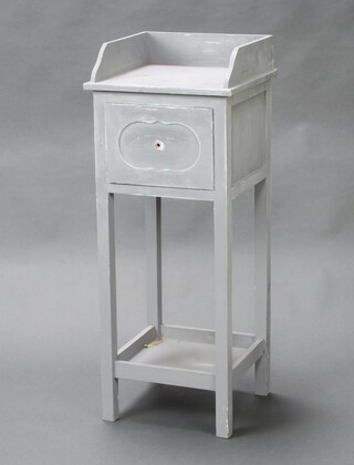 A grey painted bedside table with 3/4 gallery, frieze drawer and undertier 84cm h x 33cm w x 30cm d 