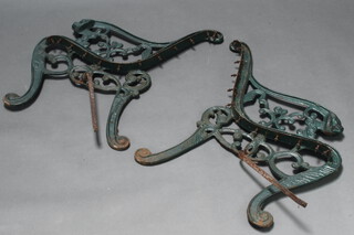 A pair of cast metal garden bench/seat ends with lion mask decoration 72cm h x 51cm w 