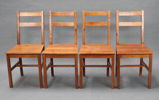 A set of 4 pine stick back chairs together with a rectangular pine table (some marks to the top) 73cm h x 119cm l x 74cm w 