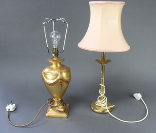 A gilt plaster table lamp in the form of an urn on square base 33cm h, a candlestick shaped wrought iron table lamp with shade 48cm h, and a gilt table lamp 30cm h together with 2 Victorian brass candlesticks 20cm and 18cm