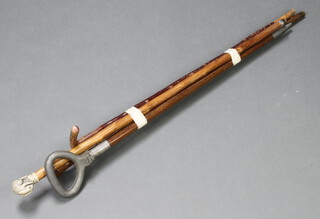 A folding walking stick together with 3 other walking sticks