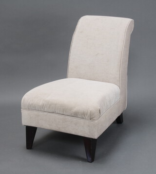 A nursing chair upholstered in white material 78cm h x 56cm w x 70cm d (seat 35cm x 46cm) (very slight stain to seat)