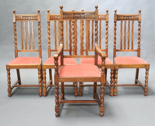 A set of 5 1930's oak stick and rail back dining chairs with barley twist columns to the sides comprising 4 standard 110cm h x 54cm w x 50cm d (seat 31cm x 31cm) and 1 carver 110cm h x 45cm w x 40cm d (seat 39cm x 25cm) raised on spiral turned supports with H framed stretchers and pink upholstered drop in seats 
