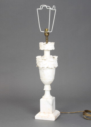 A carved alabaster table lamp in the form of an urn on a square base 50cm h (some chips and section of marble missing) 
