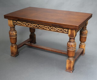 A 17th Century style carved oak draw leaf dining table with H frame stretcher 75cm h x 123cm x 77cm 