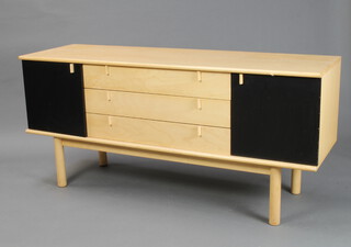 A mid Century ebonised and beech finished sideboard fitted 3 long drawers flanked by a pair of cupboards, raised on turned supports 74cm h x 160cm w x 49cm d 