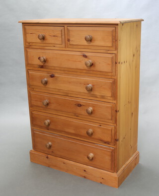 A Victorian style pine chest of 2 short and 5 long drawers with tore handles, raised on a platform base 127cm h x 89cm w x 46cm d (ring marks to the top) 