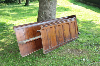 A Victorian pitch pine pew 84cm h x 271cm w (seat 266cm w x 31cm d) the pew has a cut end, together with a pew front 83cm h x 181cm w x 40cm d) the pew front has also been cut 
