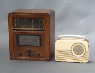 A His Master's Voice model no. 494 radio in a walnut case 49cm x 42cm x 28cm together with a Bush Type TR 82DL battery operated portable radio 24cm x 33cm x 9cm  