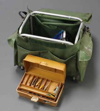 A vintage coarse fishing seat box containing reels, tackles, lures, etc, 