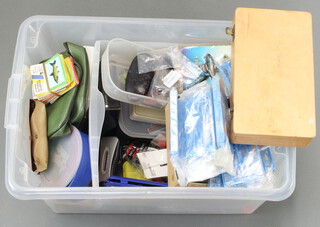 A collection of mixed fishing tackle, lures, flies, line rigs, etc contained in a plastic box 