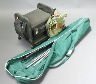 A Berkley fishing seat box, a cloth rucksack, various sea casting rods contained in a green cloth bag 