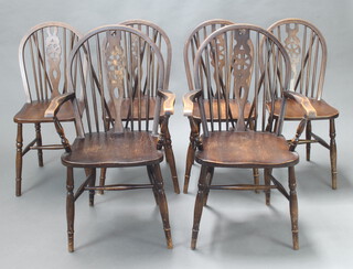 A set of 6 elm wheel back dining chairs - 2 carvers, 4 standard raised on turned supports with h framed stretchers, carvers 95cm h x 56cm w x 50cm d (seat 32cm w x 31cm d), standard chairs 89cm h x 37cm w x 45cm d 