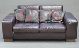 J H Hicolity, a two seat sofa upholstered in brown leather 80cm h x 175cm w x 91cm d (seat 120cm w x 50cm d) 