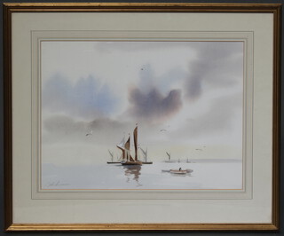 A 20th Century watercolour indistinctly signed, moored fishing vessels 36cm x 49cm 

