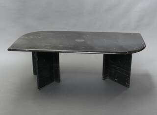 A black veined marble effect coffee table raised on shaped supports 43cm h x 119cm l x 60cm w  (stain to top) 
