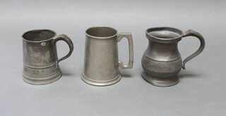A 19th Century pewter pint mug, a baluster ditto and 1 other 