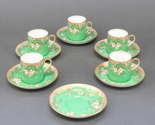 A Crown Staffordshire coffee set with 5 cups and 6 saucers having green, gilt and floral decoration 