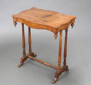 A Victorian shaped mahogany work table of shaped outline, fitted a drawer and raised on turned supports with H framed stretcher 69cm h x 63cm w x 42cm d (old but treated worm to the stretcher and feet) 