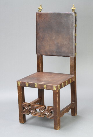 A Mexican antique style leather and oak high back hall chair with brass finials, the seat and back upholstered in brown leather with impressed mark and label to underside  117cm h x 46cm w x 43cm d (seat 38cm x 36cm)
