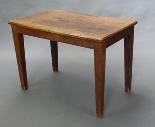 An Edwardian rectangular oak table raised on square tapered supports 71cm h x 100cm w x 63cm d (some ring marks to the top) 
