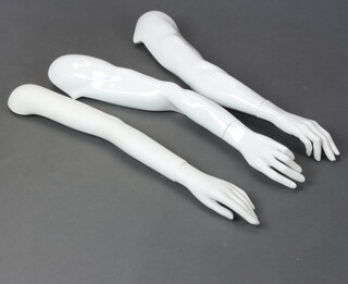Three white plastic mannequin arms complete with hands and 1 other (no hand) 80cm l 