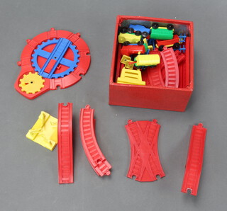 A child's 1970's plastic train set contained in a metal tin 
