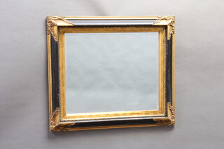 A rectangular bevelled plate wall mirror contained in a black and gilt frame 49cm x 60cm 