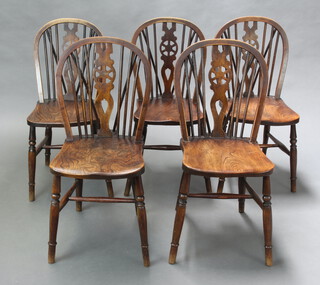 A set of 5 elm wheel back dining chairs with solid seats, raised on turned supports with H framed stretchers 88cm h x 37cm w x 46cm (27cm x 27cm, 1 has a loose leg)
