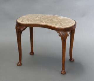 A Queen Anne style walnut kidney shaped dressing table stool raised on cabriole supports 47cm h x 61cm w x 32cm d 