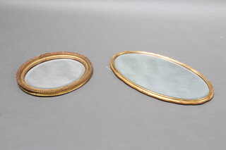 An oval bevelled plate wall mirror contained in a decorative gilt frame 49cm x 39cm together with 1 other 71cm x 43cm 
