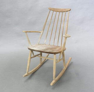 An Ercol style bleached elm stick and rail back rocking chair 89cm h x 66cm w x 46cm (seat 33cm x 35cm) 