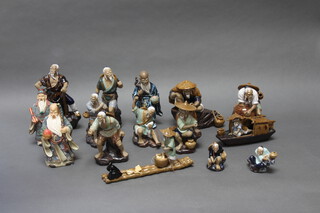 A 20th Century Chinese slip glazed figure of a warrior 15cm and 17 other Chinese figures