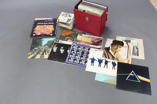 A quantity of 1960/70/80's LP's, albums including The Beatles Hard Days Night, With the Beatles, Rubber Sole, Please Please Me, Abbey Road and a collection of Rock and others, all in poor condition together with a box containing approx. 20 1960's rock and sole 45rpm records  