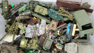 A collection of model tanks and other military vehicles contained in a  plastic crate 
