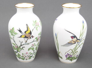 A pair of Franklin Mint Woodland Bird vases 30cm 