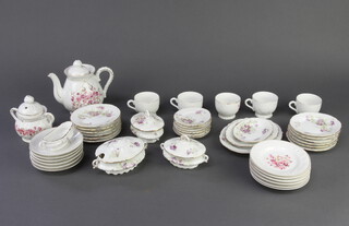 Two children's part tea sets decorated with flowers 
