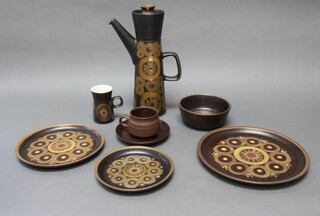 A Denby Arabesque tea, coffee and dinner service comprising 4 tea cups, 4 saucers, coffee pot, cream jug, milk mug, 12 coffee cups, 12 saucers, 8 small plates (2 chipped), 8 medium plates (2 chipped), 8 dinner plates, sauce boat (chipped) and stand, small dish, serving plate, 8 dessert bowls, 2 others 