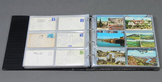 An album of black and white and coloured postcards including 1960's saucy postcards, tourist, etc together with a box of postcards including a book of 14 WWI etc