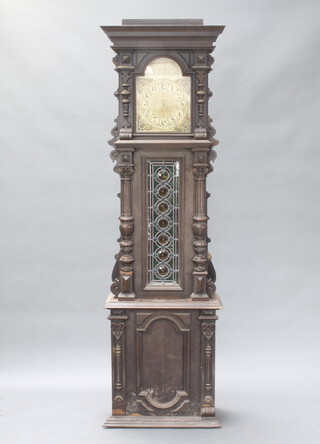 A Victorian carved oak longcase clock case with lead glazed panelled door 200cm h x 59cm w x 30cm d (in bar condition, sections of timber missing in places) containing a later striking movement with 29cm x 40cm dial and together with a purple plastic crate containing various timber 
