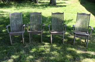 Alexander Rose, a set of 4 well weathered slatted wooden garden armchairs raised on square supports 105cm h x 62cm w x 40cm (seat 36cm x 32cm) 